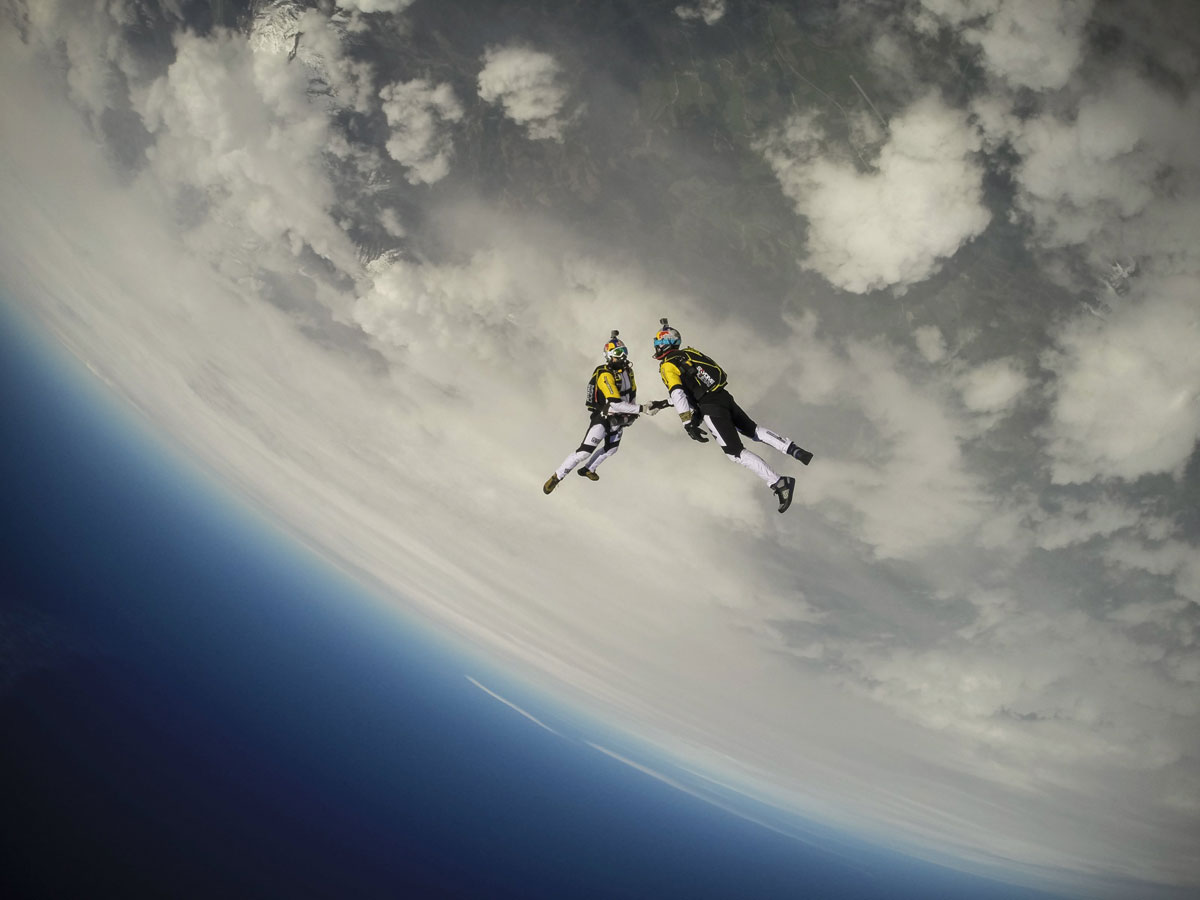 skydivers-shaking-hands-mid-air.jpg